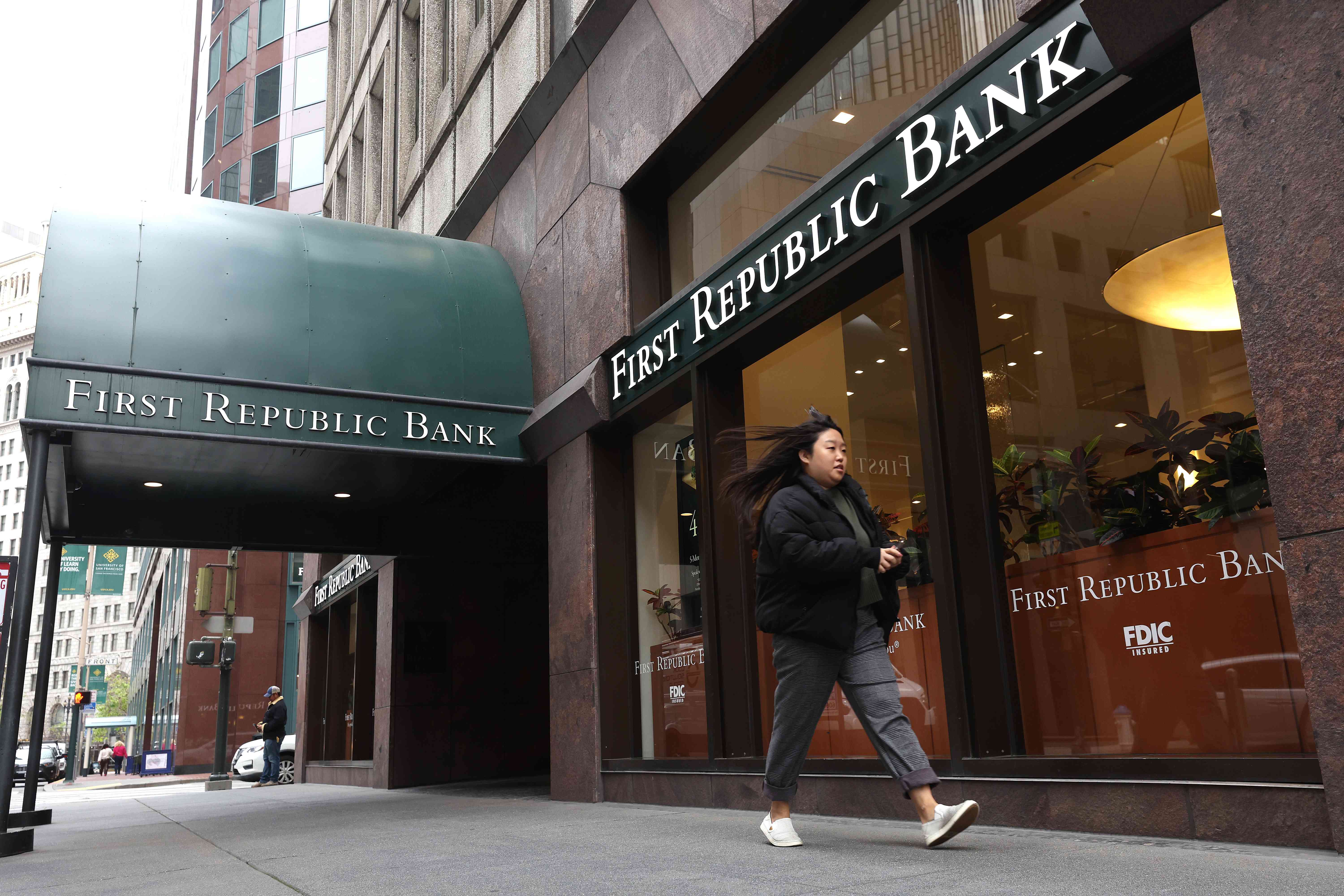 A person walks by a First Republic Bank branch.