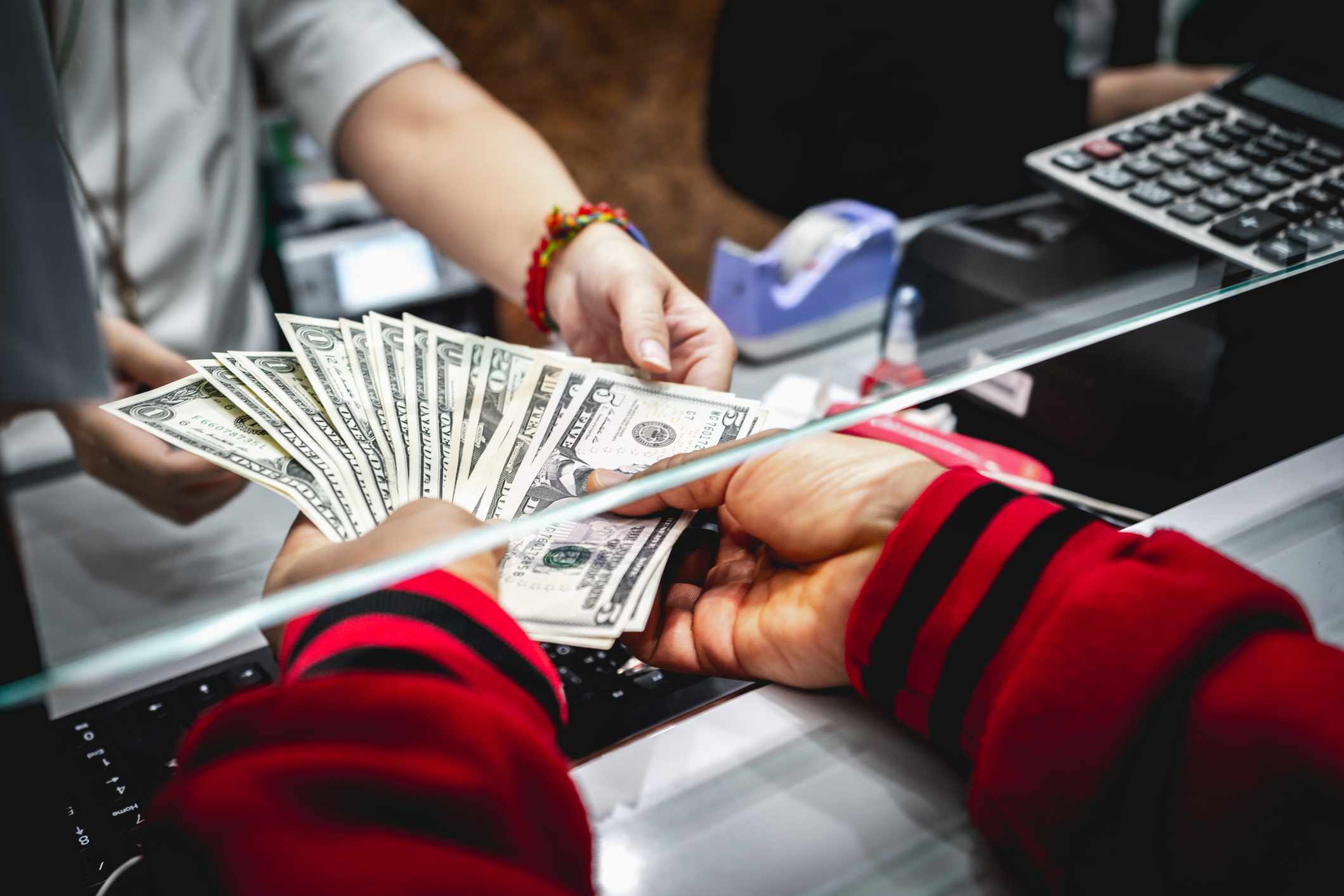 Person depositing money into the bank