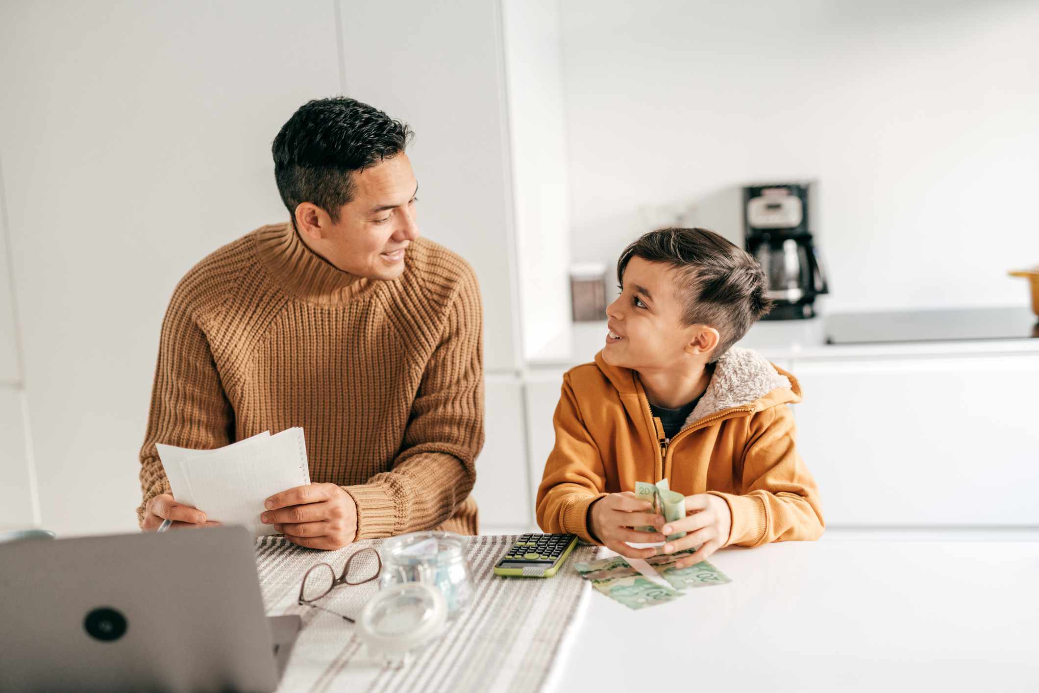 A parent and child talk about money.