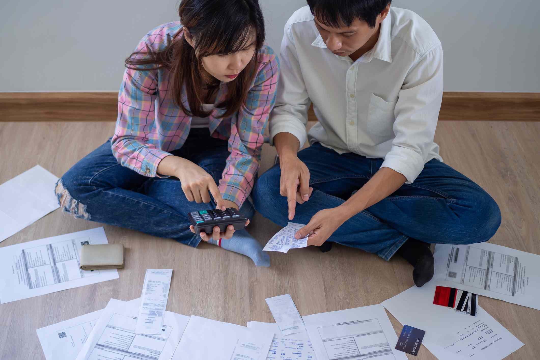 Young couple looking at receipts