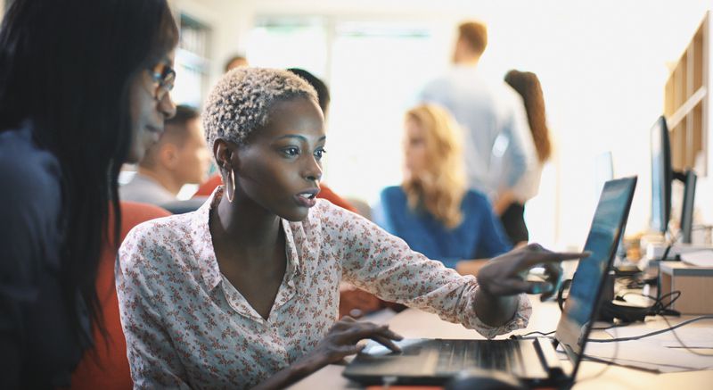 Women going over computer