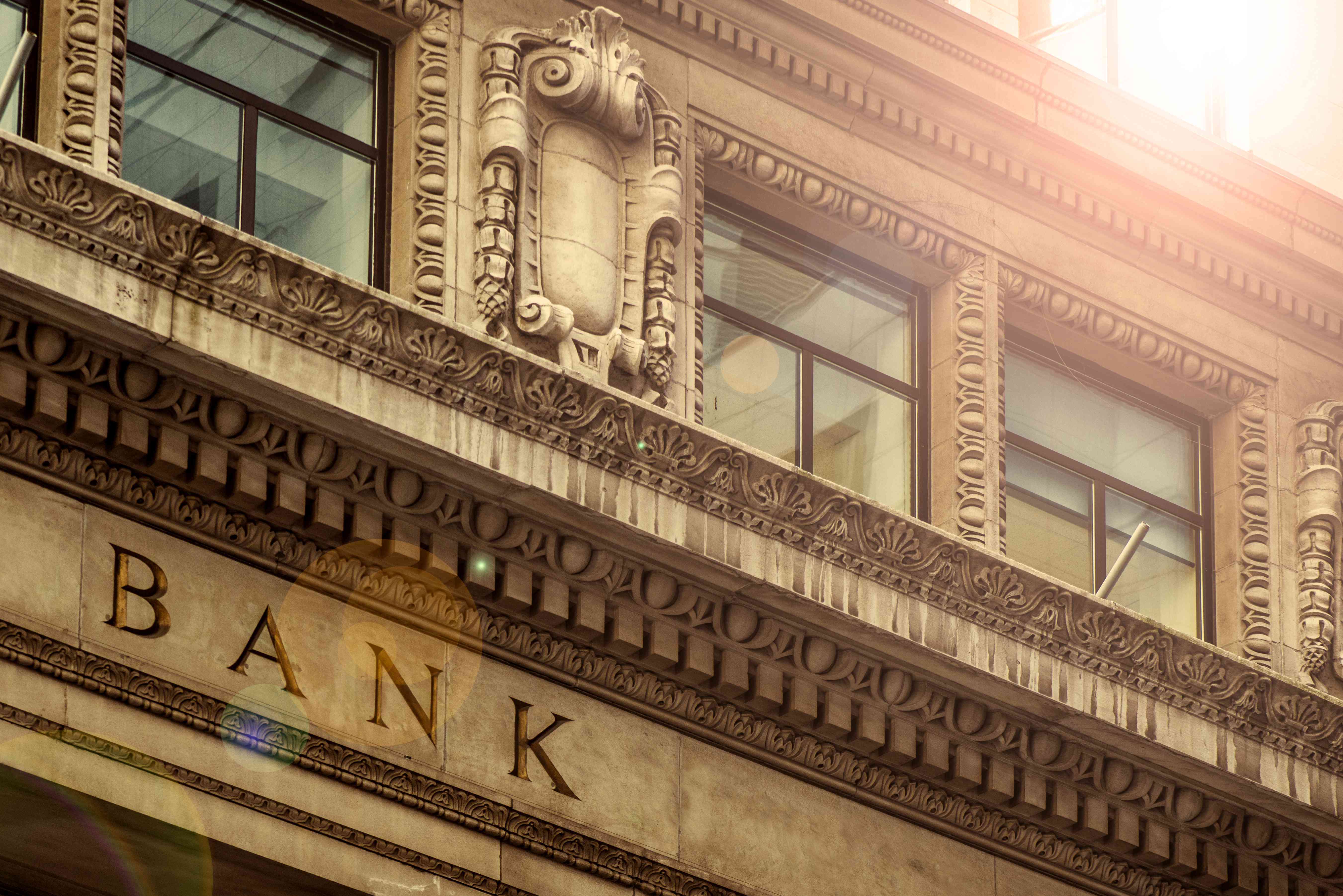 Part of the front of an ornate bank building