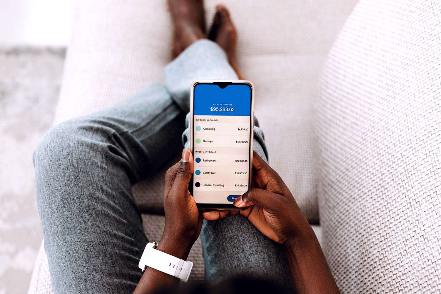 Overhead view of young woman managing online banking