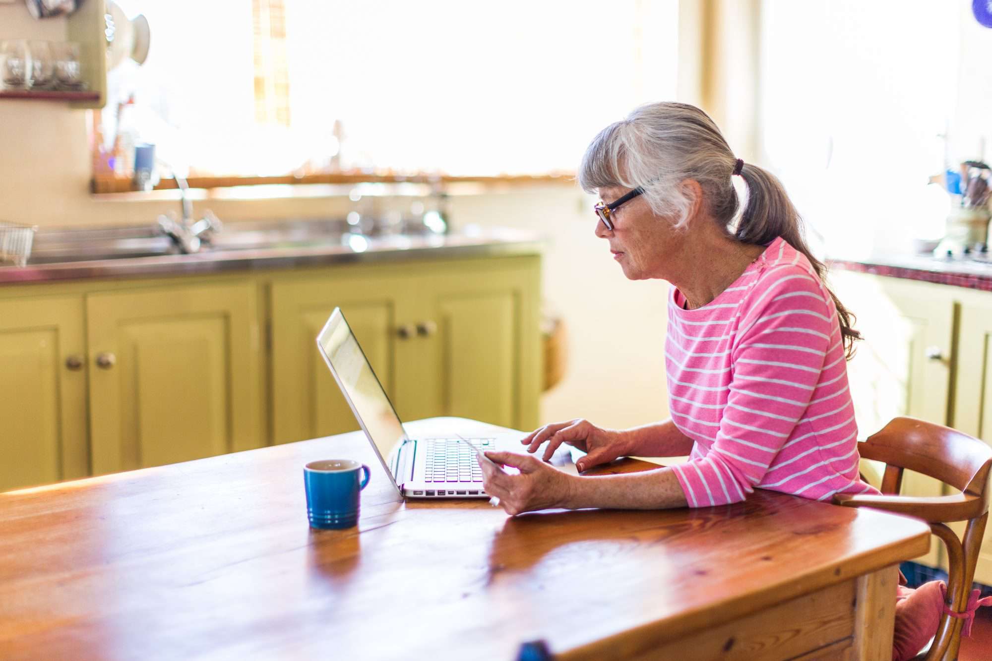 Woman shopping online with a credit card